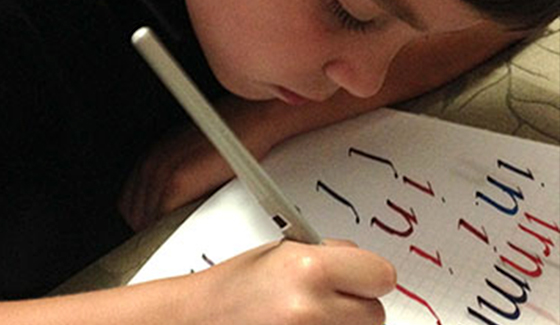 Calligraphy student practicing in one-on-one private class